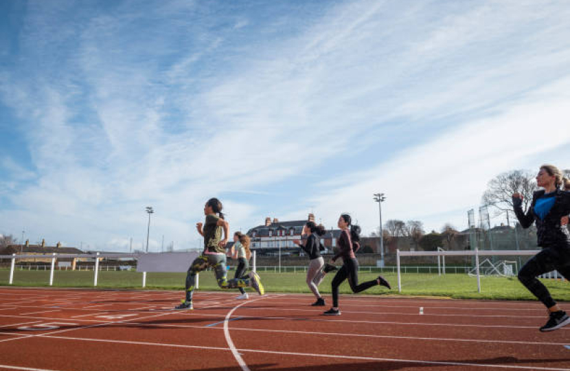 People running on athletics track