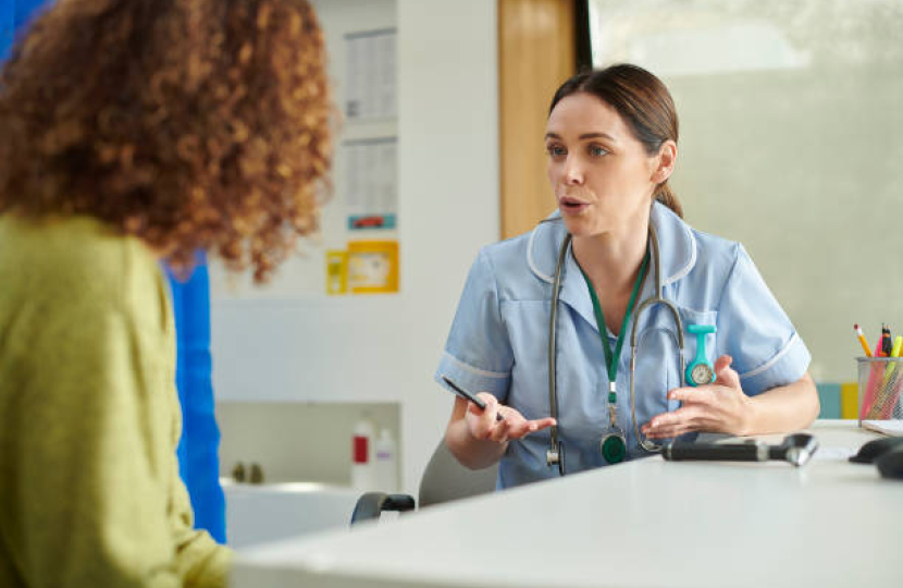 Nurse talking to patient